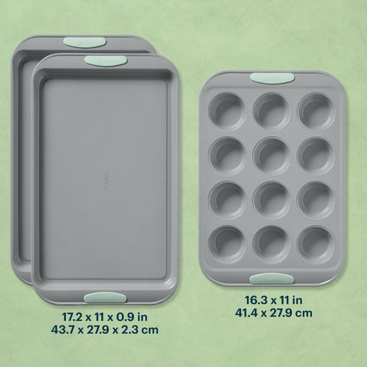 Set of three gray baking trays with measurements on a green background
