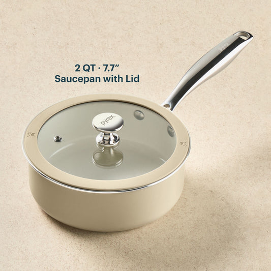 Beige saucepan with lid on a beige background