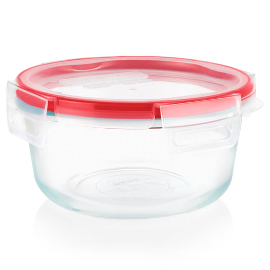 Clear glass food container with a red lid on a white background