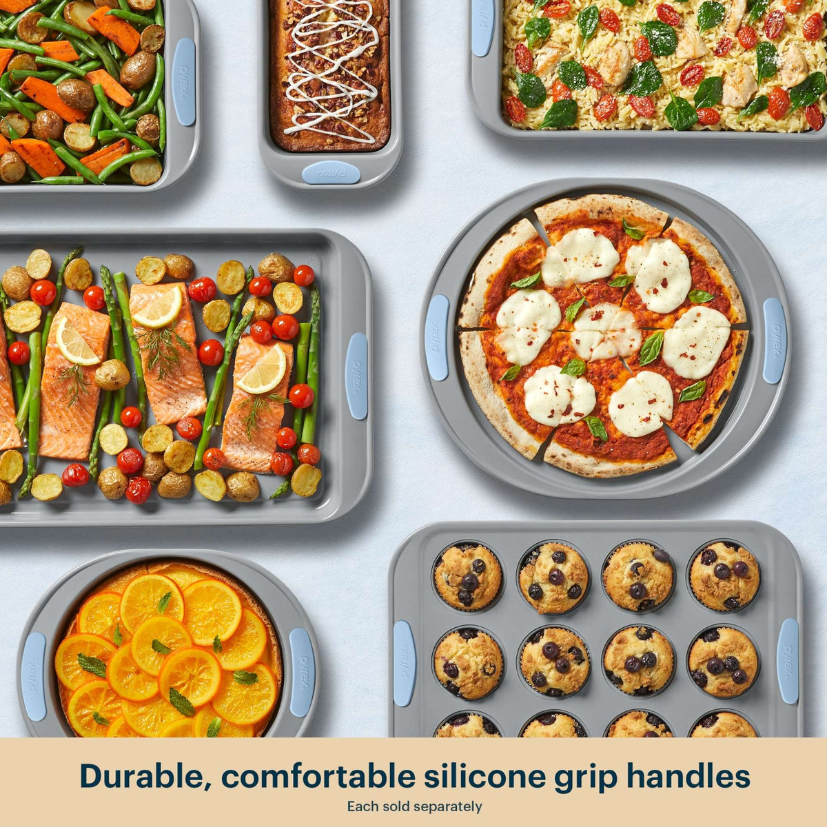 Collection of silicone baking pans with various food items on a light gray background.