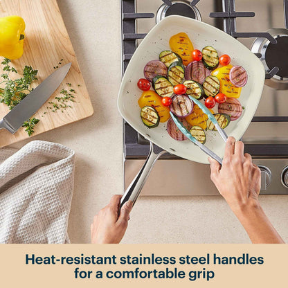Person holding a frying pan with vegetables on a kitchen counter, text about heat-resistant handles.